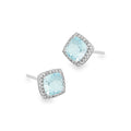 A pair of square stud earrings featuring light blue aquamarines surrounded by a halo of small diamonds, set in a white gold on a plain white background.