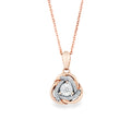 A rose gold necklace with a pendant featuring a central diamond surrounded by a double-layered design of rose gold and white gold pavé-set diamonds, shown on a plain white background.