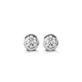 White gold and cubic zirconia stud earrings with bezel settings. 