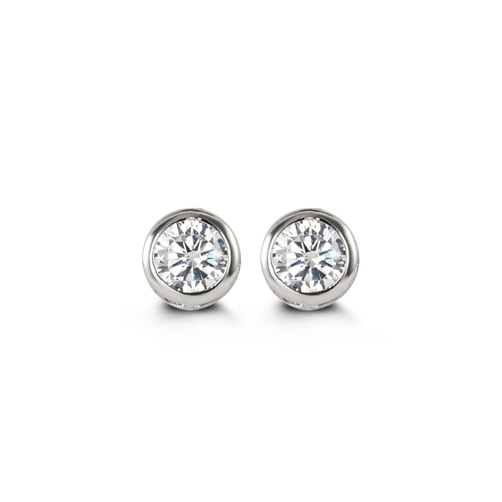 White gold and cubic zirconia stud earrings with bezel settings. 