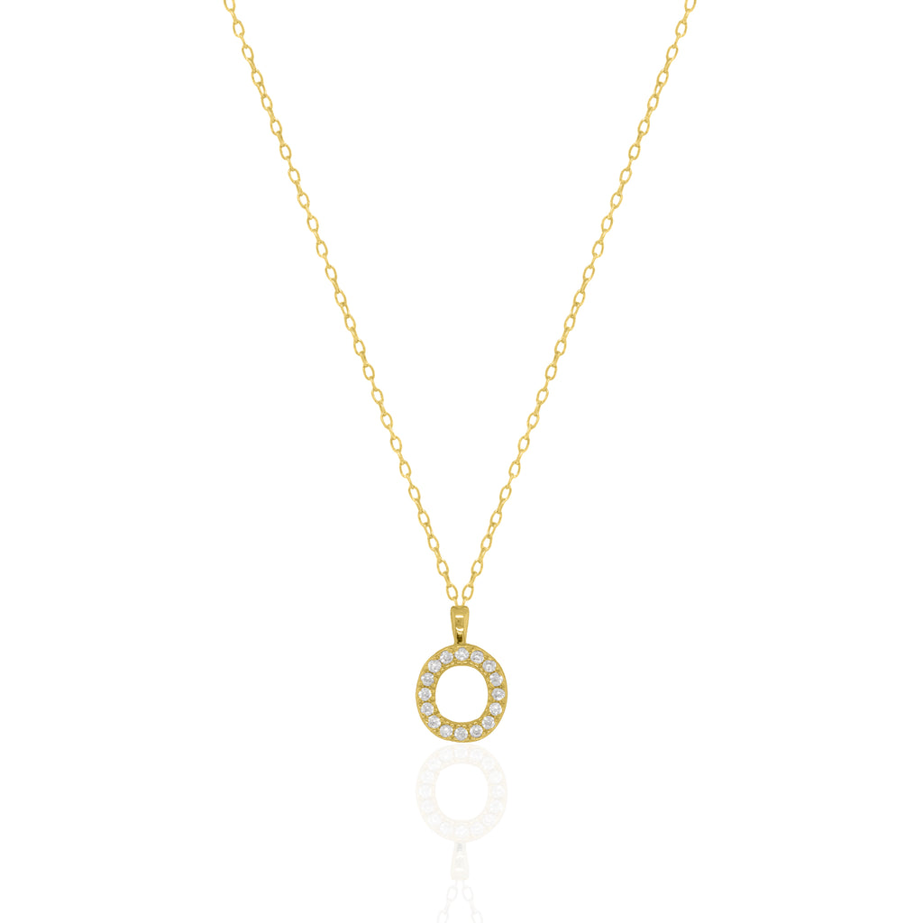 A goldtone initial necklace featuring a  letter pendant set with small clear stones, suspended from a delicate gold chain against a white background.