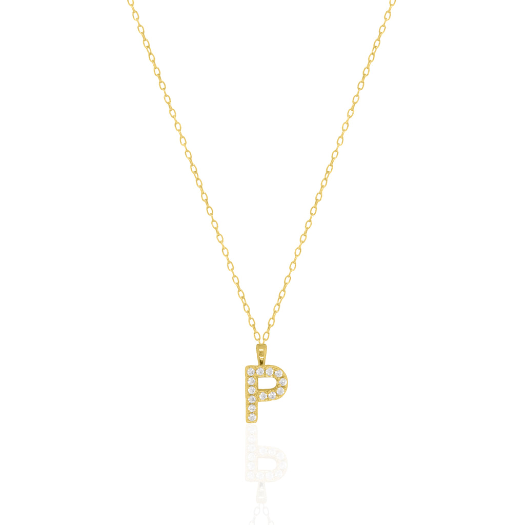 A goldtone initial necklace featuring a  letter pendant set with small clear stones, suspended from a delicate gold chain against a white background.