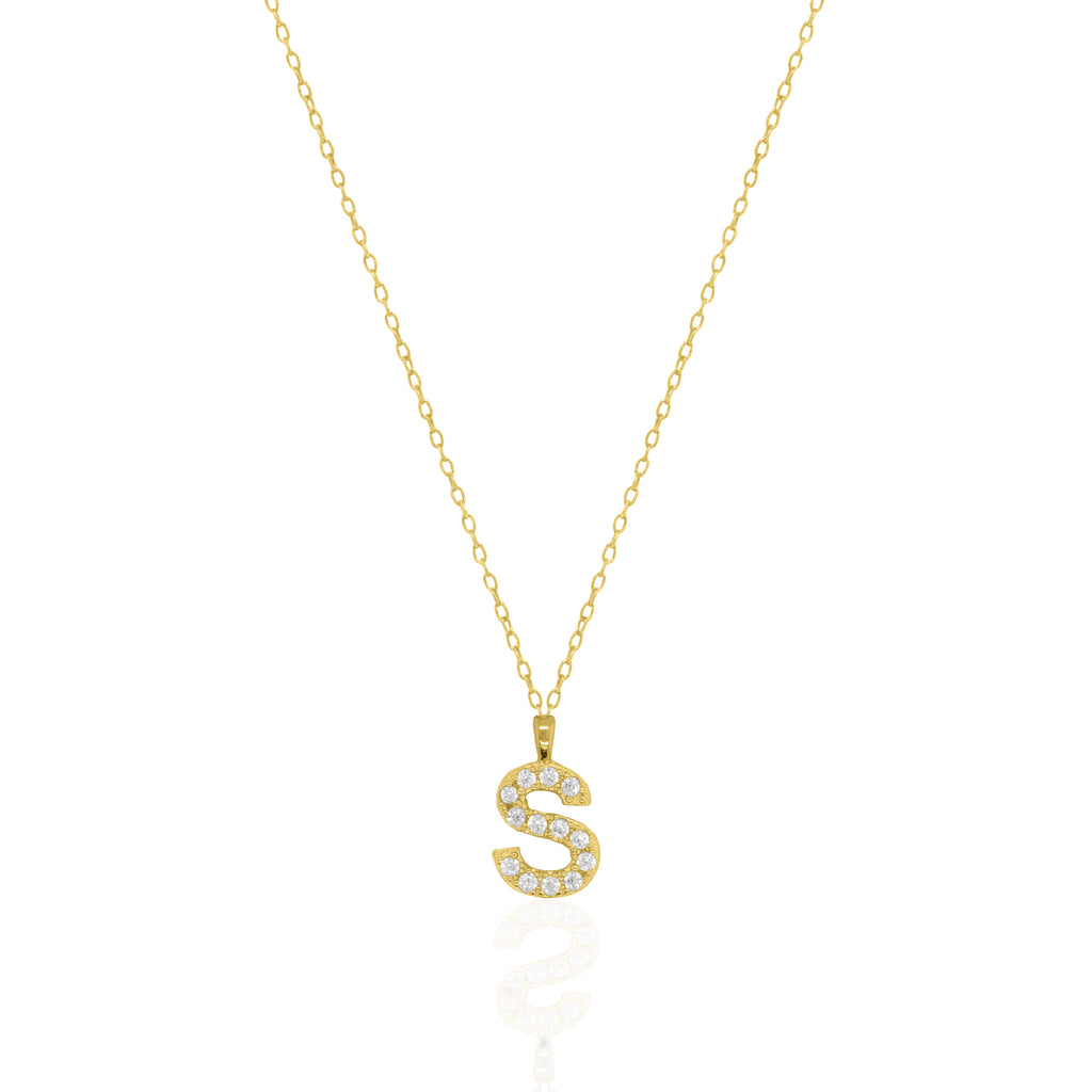 A goldtone initial necklace featuring a  letter pendant set with small clear stones, suspended from a delicate gold chain against a white background.