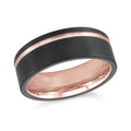 Black and rose gold ring on a white background