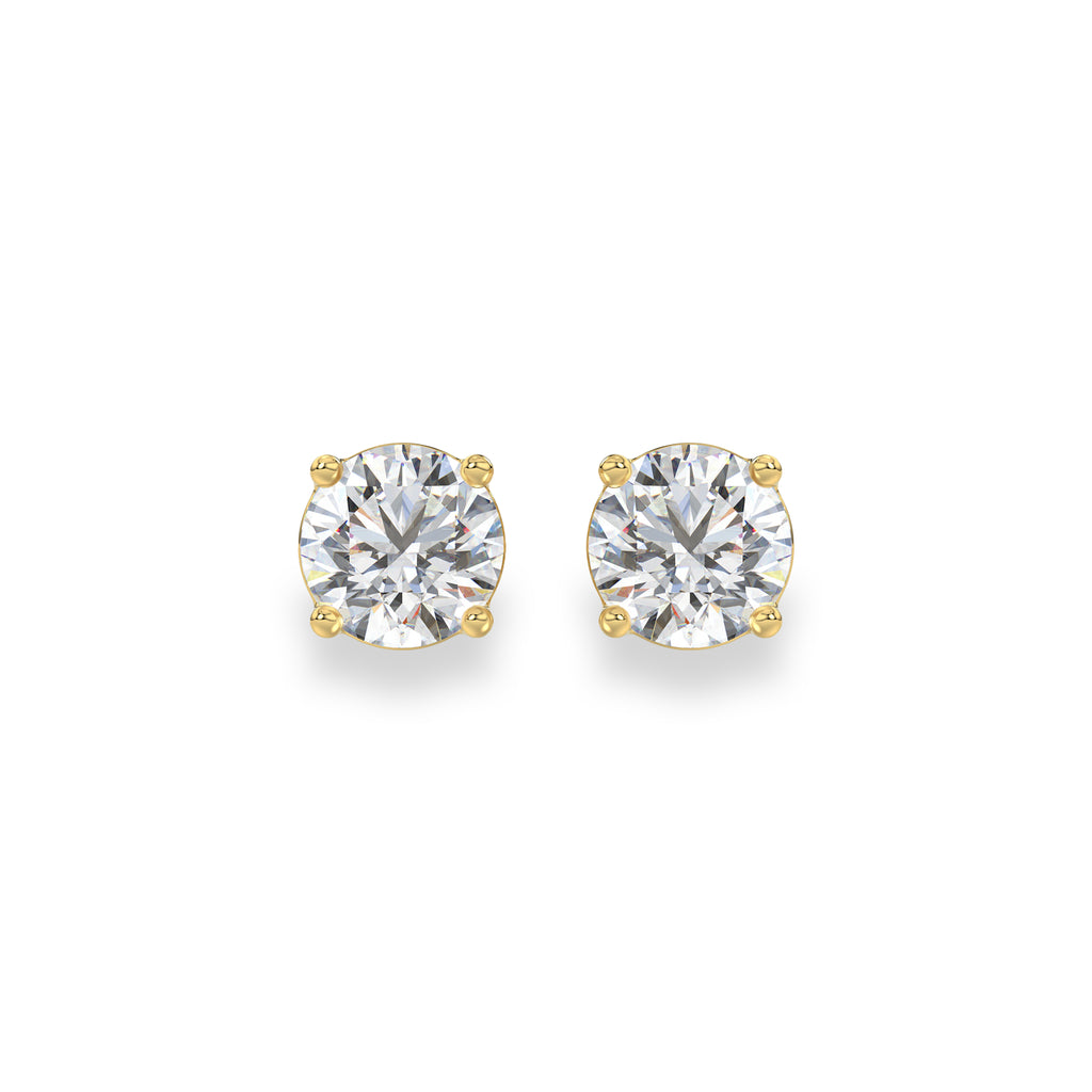 A pair of round-cut solitaire stud earrings in yellow gold four-prong settings, shown on a clean white background.