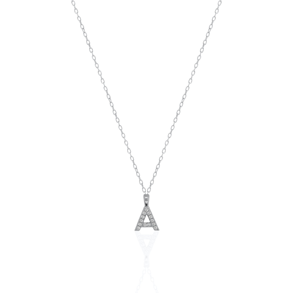 A silver initial necklace featuring a  letter pendant set with small clear stones, suspended from a delicate gold chain against a white background.