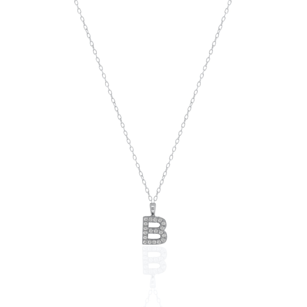 A silver initial necklace featuring a  letter pendant set with small clear stones, suspended from a delicate gold chain against a white background.