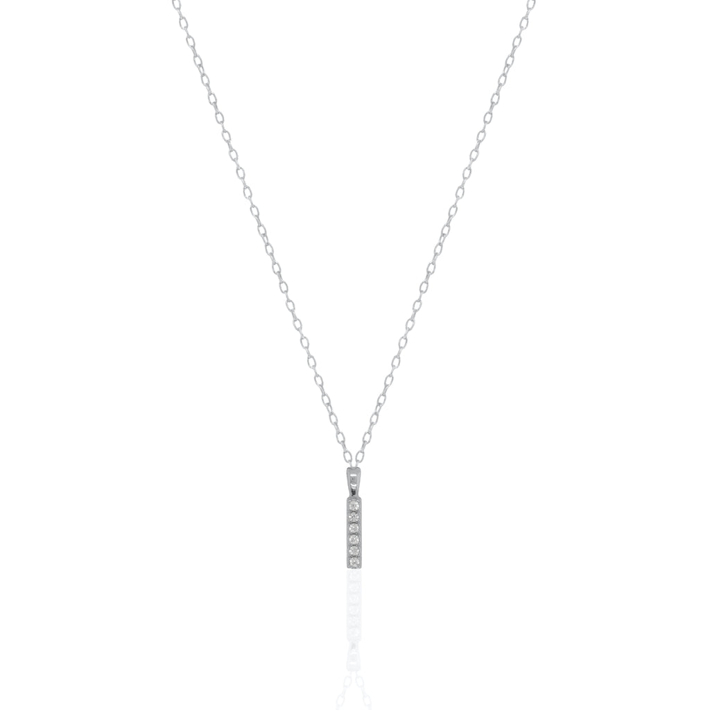 A silver initial necklace featuring a  letter pendant set with small clear stones, suspended from a delicate gold chain against a white background.