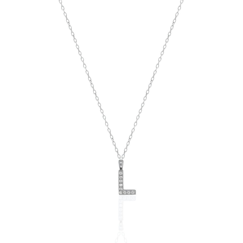 A silver initial necklace featuring a  letter pendant set with small clear stones, suspended from a delicate gold chain against a white background.