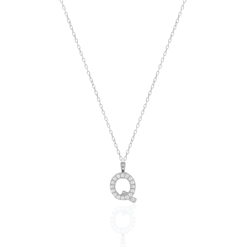 A silver initial necklace featuring a  letter pendant set with small clear stones, suspended from a delicate gold chain against a white background.