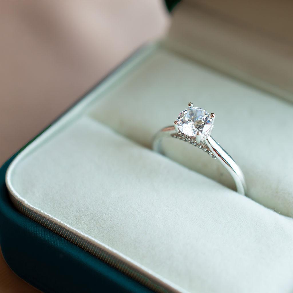 Silver ring with a diamond in a jewelry box