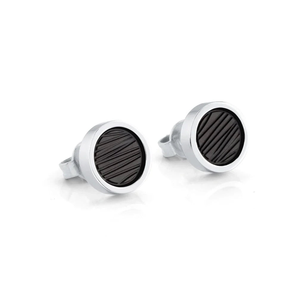 A pair of round stud earrings with polished silver-toned bezels and dark textured inlay, shown on a clean white background.